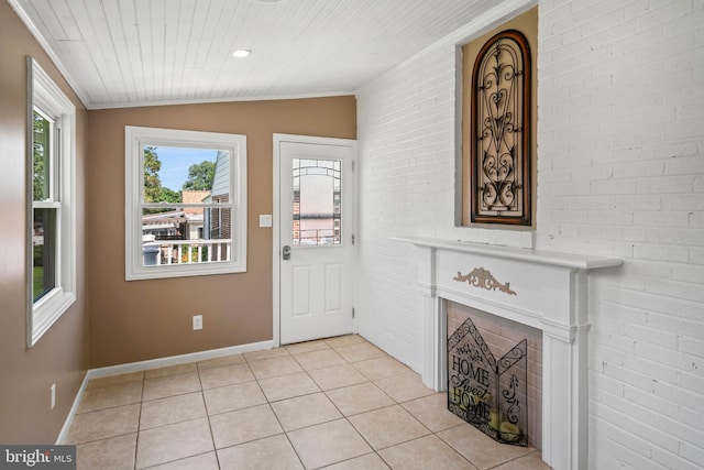 51 E Ann Rd, Broomall, PA 19008 - foyer entrance with light tile patterned floors, lofted ceiling, wood ceiling, brick wall, and a fireplace