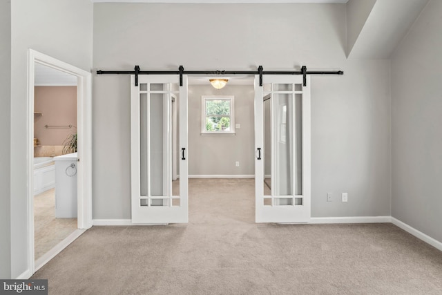 51 E Ann Rd, Broomall, PA 19008 - carpeted spare room featuring a barn door and baseboards