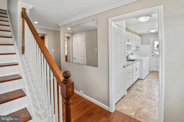 51 E Ann Rd, Broomall, PA 19008 - stairs featuring washing machine and clothes dryer, ornamental molding, wood finished floors, and recessed lighting