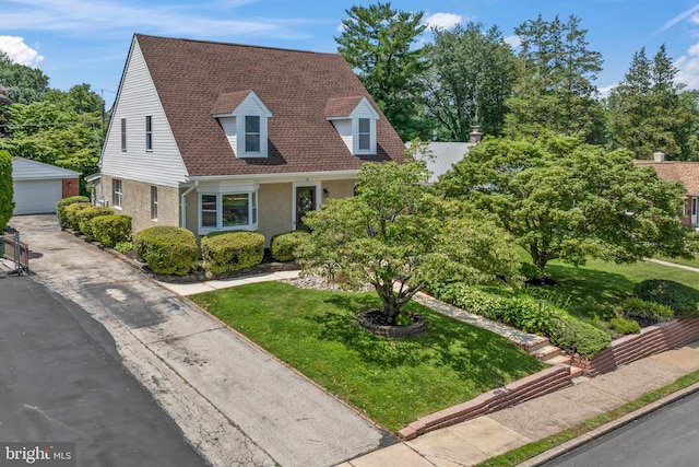 51 E Ann Rd, Broomall, PA 19008 - cape cod-style house featuring an outdoor structure, a detached garage, and a front lawn