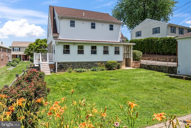 51 E Ann Rd, Broomall, PA 19008 - rear view of house featuring a yard, a wooden deck, a shingled roof, and stairs