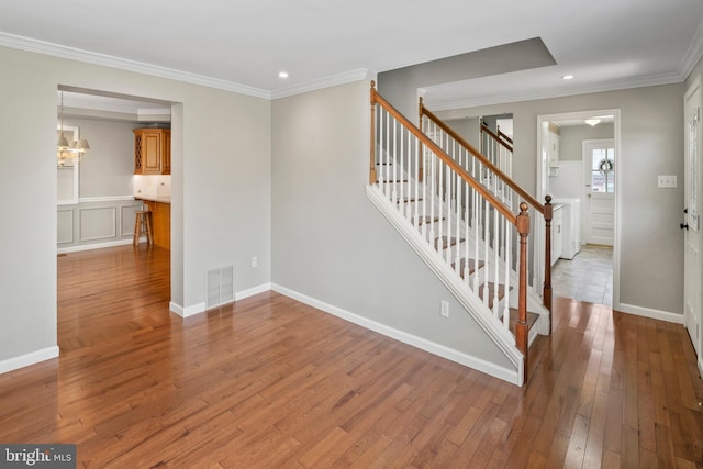 51 E Ann Rd, Broomall, PA 19008 - stairway with wood-type flooring, crown molding, and recessed lighting