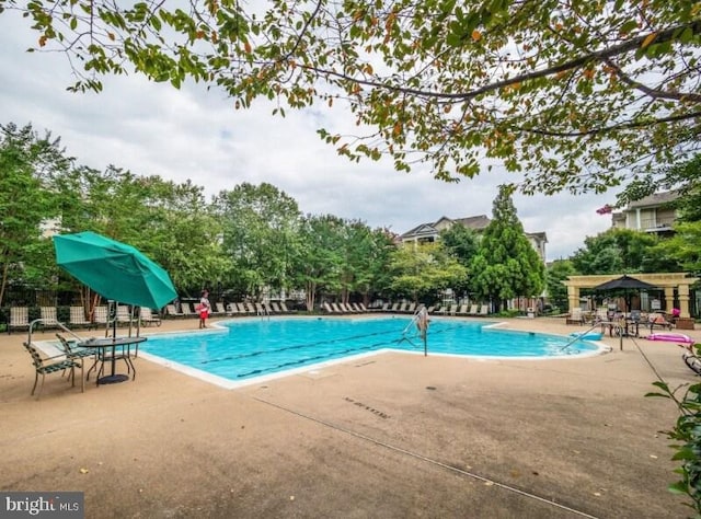 19609 Galway Bay Cir Unit 303, Germantown, MD 20874 - community pool featuring a patio area