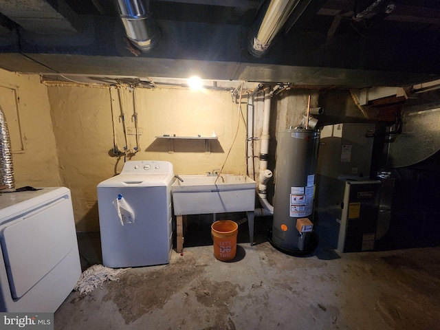 3137 Oakford Ave, Baltimore, MD 21215 - unfinished below grade area featuring water heater and independent washer and dryer