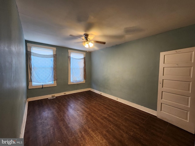 3137 Oakford Ave, Baltimore, MD 21215 - spare room with a ceiling fan and dark wood-style flooring