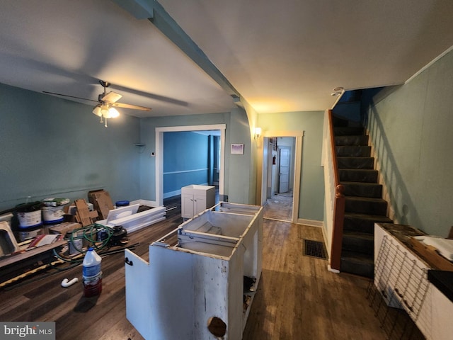3137 Oakford Ave, Baltimore, MD 21215 - living area featuring dark wood-type flooring, stairs, and a ceiling fan