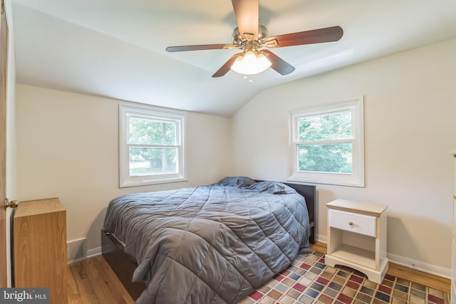 2303 Mulberry Ln, Lafayette Hill, PA 19444 - bedroom with multiple windows, wood finished floors, vaulted ceiling, and a ceiling fan