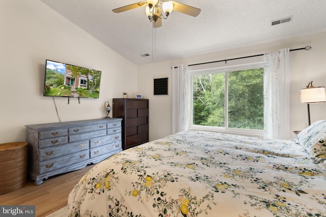 3086 Bridgeton Ct, Woodbridge, VA 22192 - bedroom featuring wood finished floors, lofted ceiling, a textured ceiling, and ceiling fan
