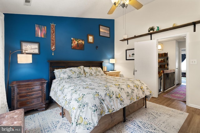 3086 Bridgeton Ct, Woodbridge, VA 22192 - bedroom featuring wood finished floors, vaulted ceiling, and ceiling fan