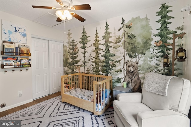 3086 Bridgeton Ct, Woodbridge, VA 22192 - bedroom with wood finished floors, a closet, and a ceiling fan