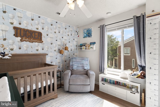 3086 Bridgeton Ct, Woodbridge, VA 22192 - bedroom featuring wood finished floors, a textured ceiling, and a ceiling fan