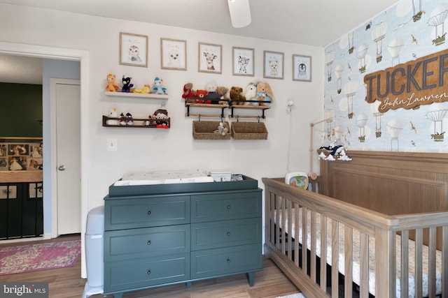 3086 Bridgeton Ct, Woodbridge, VA 22192 - bedroom with a crib and light wood-type flooring