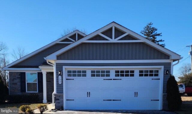 100 Senators Way, Berlin, NJ 08009 - view of front of property with stone siding, an attached garage, board and batten siding, and driveway