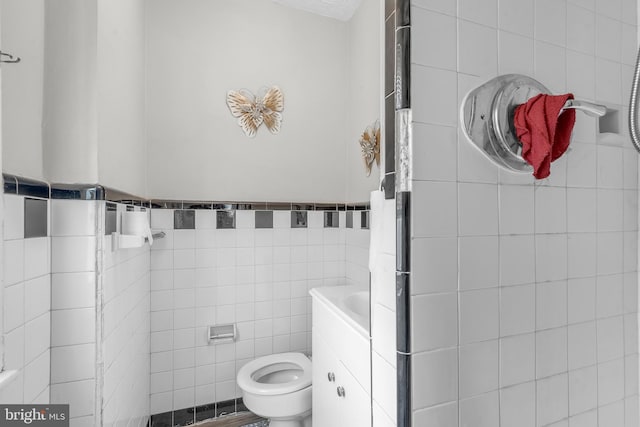 438 Holly Rd, Lansdowne, PA 19050 - bathroom featuring tile walls and toilet