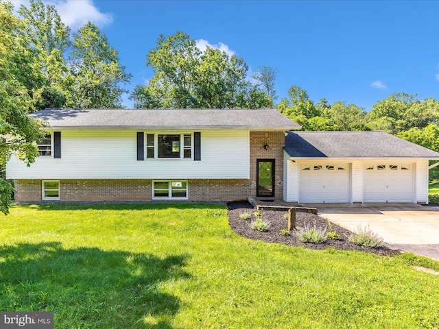 4431 Cherry Tree Ln, Sykesville, MD 21784 - tri-level home with an attached garage, a front lawn, driveway, and brick siding