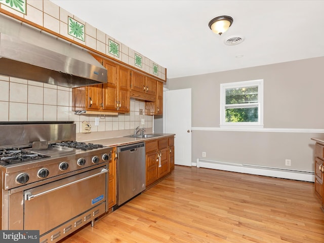 4431 Cherry Tree Ln, Sykesville, MD 21784 - kitchen featuring stainless steel appliances, a baseboard radiator, extractor fan, and brown cabinets