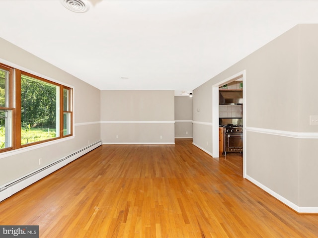 4431 Cherry Tree Ln, Sykesville, MD 21784 - spare room with a baseboard radiator and light wood-type flooring