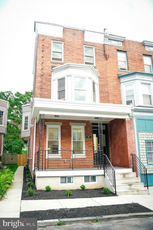 136 W Gorgas Ln, Philadelphia, PA 19119 - view of property with covered porch and brick siding