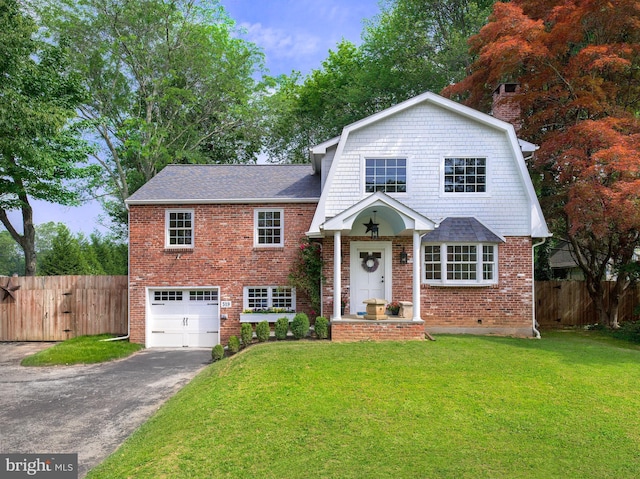 319 W Conestoga Rd, Devon, PA 19333 - view of front of home featuring driveway, an attached garage, brick siding, and roof with shingles