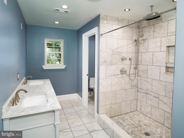 319 W Conestoga Rd, Devon, PA 19333 - bathroom with marble finish flooring, tiled shower, double vanity, and recessed lighting