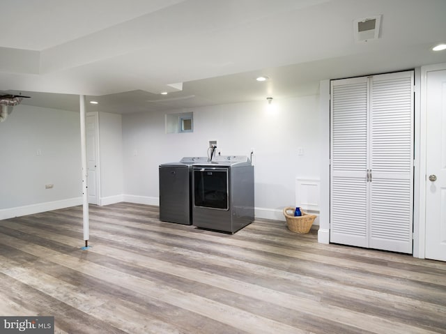 319 W Conestoga Rd, Devon, PA 19333 - laundry area featuring washing machine and dryer, wood finished floors, and recessed lighting