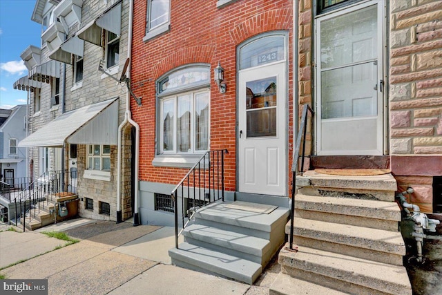 1243 Buttonwood St, Reading, PA 19604 - doorway to property featuring brick siding
