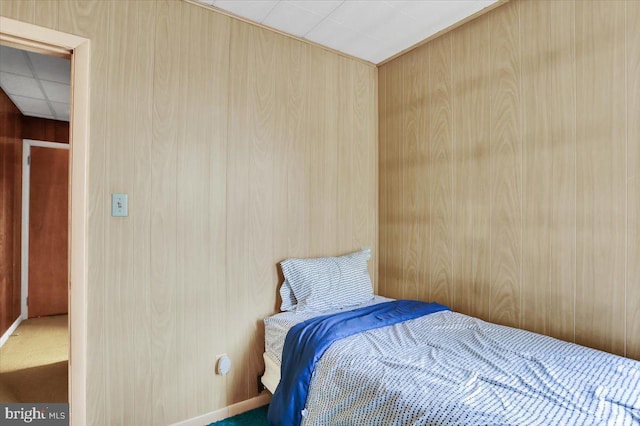 1243 Buttonwood St, Reading, PA 19604 - bedroom featuring carpet and wooden walls