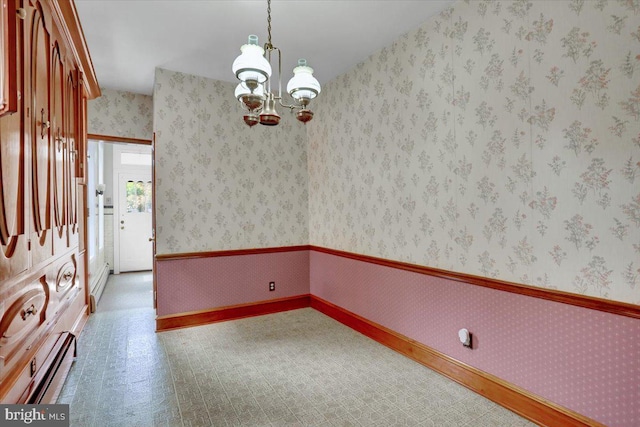 1243 Buttonwood St, Reading, PA 19604 - spare room featuring baseboard heating, a chandelier, and wallpapered walls