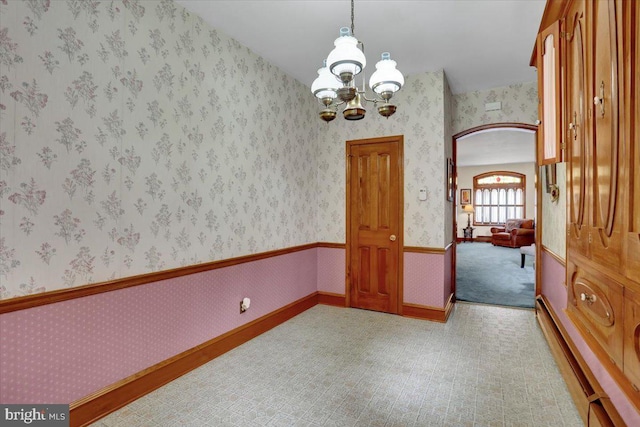 1243 Buttonwood St, Reading, PA 19604 - spare room featuring a chandelier and wallpapered walls