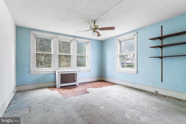 29 N Maple Ave, Lansdowne, PA 19050 - unfurnished room with carpet flooring, radiator heating unit, plenty of natural light, a ceiling fan, and a textured ceiling