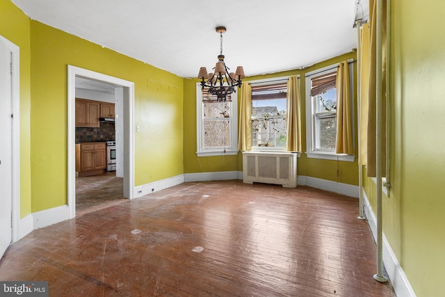 29 N Maple Ave, Lansdowne, PA 19050 - unfurnished dining area with radiator heating unit, a chandelier, and wood-type flooring
