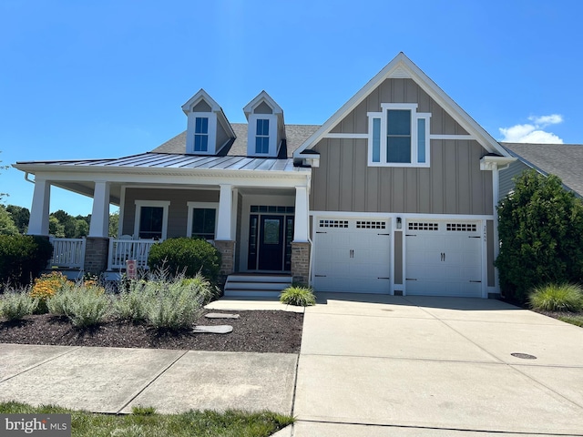 38466 Honeysuckle Ter, Selbyville, DE 19975 - craftsman inspired home featuring a standing seam roof, board and batten siding, driveway, an attached garage, and a metal roof
