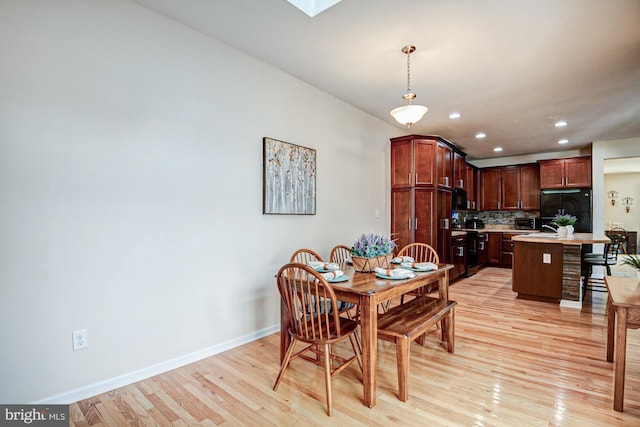 1814 S Pollock Way, Middletown, DE 19709 - dining space with light wood finished floors, recessed lighting, and a skylight