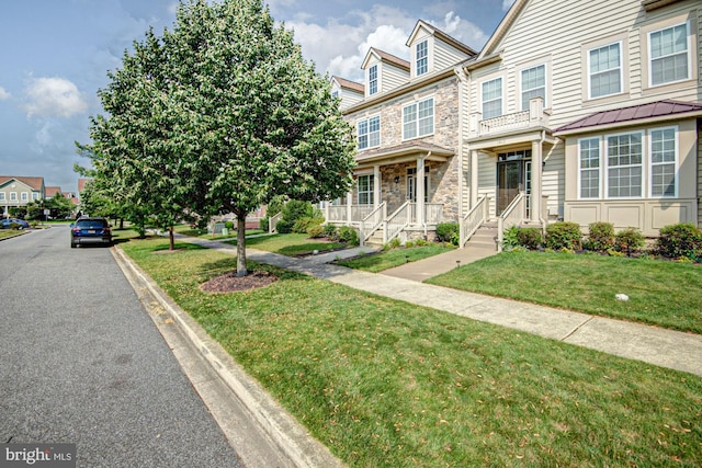 1814 S Pollock Way, Middletown, DE 19709 - townhome / multi-family property featuring stone siding and a front yard