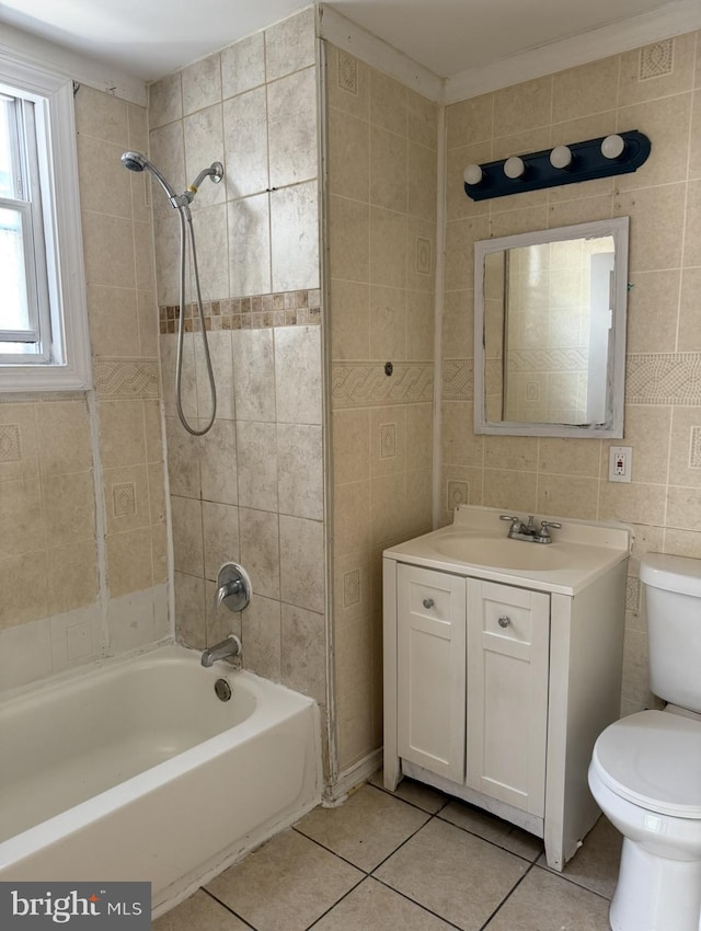 669 Long Ln, Upper Darby, PA 19082 - full bathroom featuring tile patterned floors, shower / tub combination, vanity, and tile walls