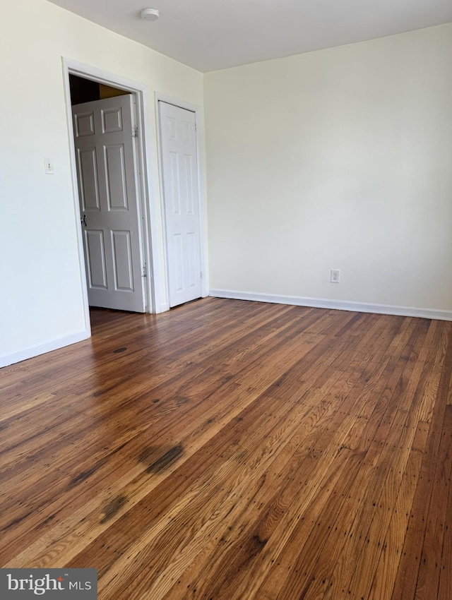 669 Long Ln, Upper Darby, PA 19082 - spare room featuring baseboards and dark wood-type flooring