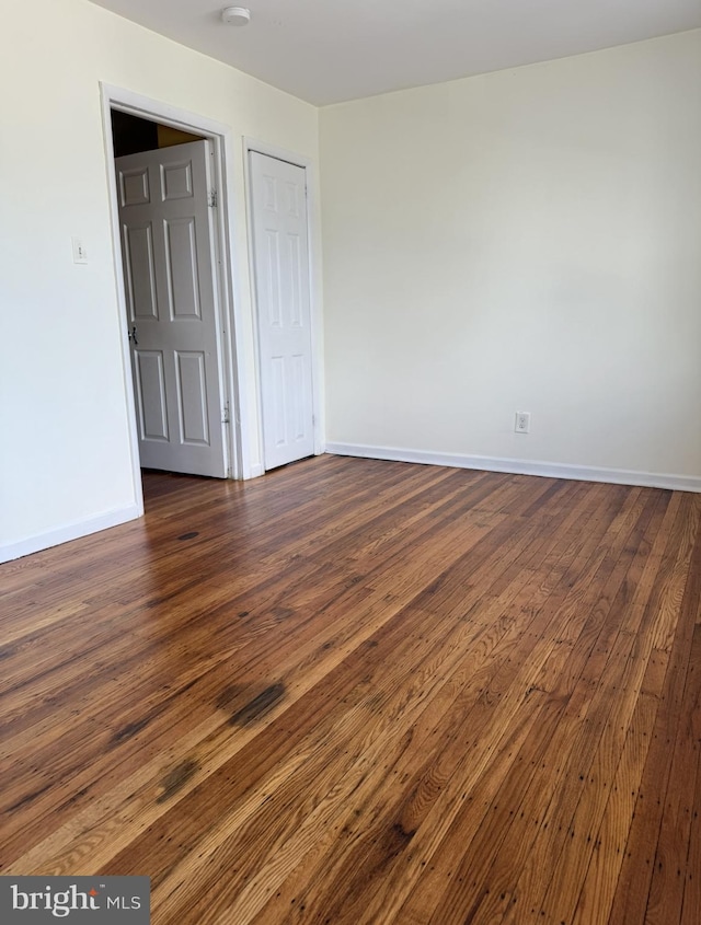 669 Long Ln, Upper Darby, PA 19082 - unfurnished room with dark wood-style floors and baseboards