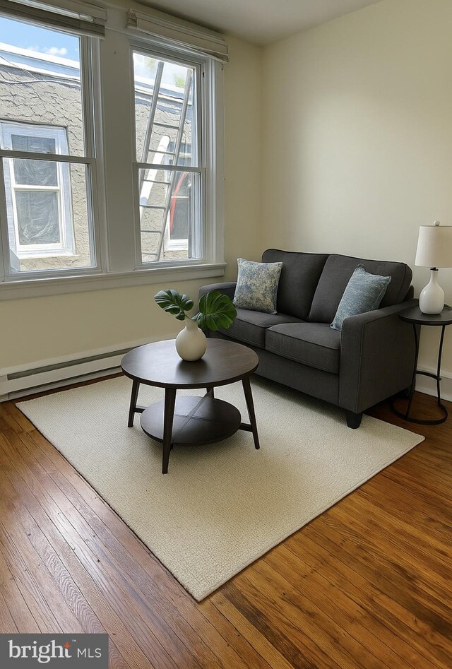 669 Long Ln, Upper Darby, PA 19082 - living area with wood finished floors and a baseboard radiator