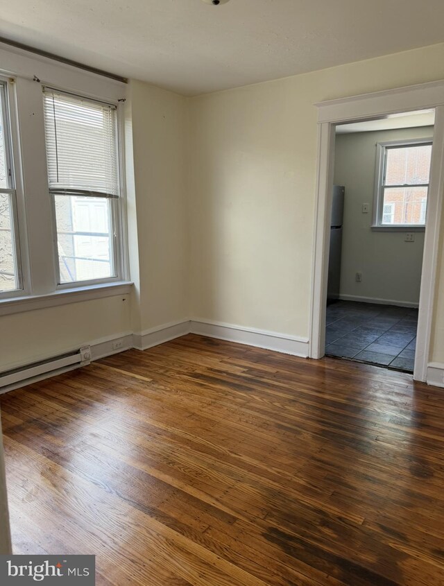 669 Long Ln, Upper Darby, PA 19082 - spare room with wood-type flooring and baseboards
