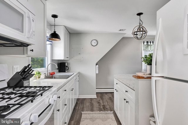 6 W 11th St, Barnegat Light, NJ 08006 - kitchen featuring white appliances, healthy amount of natural light, and white cabinetry