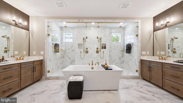 15594 Cloverland Ln, Haymarket, VA 20169 - bathroom featuring a marble finish shower, marble look tiles, a freestanding tub, and two vanities