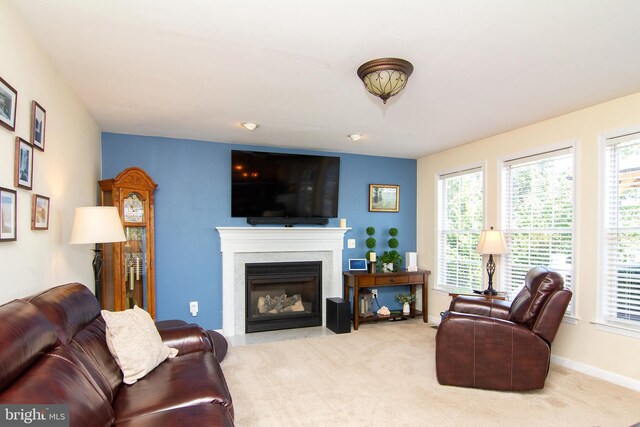 5997 Florey Rd, Hanover, MD 21076 - living area with carpet flooring, healthy amount of natural light, and a fireplace with flush hearth
