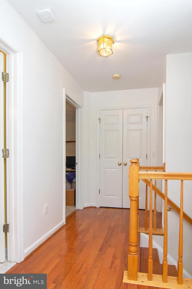 5997 Florey Rd, Hanover, MD 21076 - hall featuring light wood finished floors and an upstairs landing