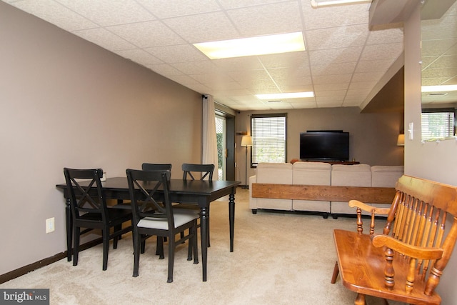 5997 Florey Rd, Hanover, MD 21076 - dining space with light colored carpet, plenty of natural light, and a paneled ceiling