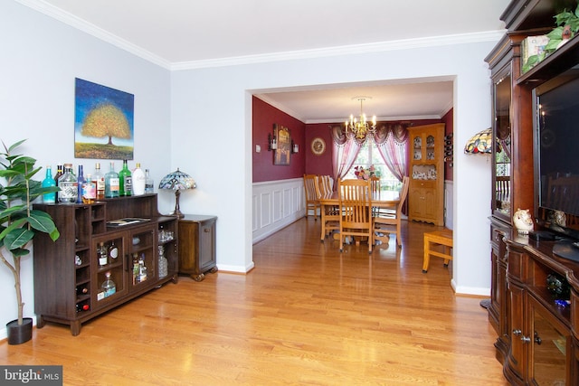 5997 Florey Rd, Hanover, MD 21076 - dining space with a chandelier, light wood-style flooring, and ornamental molding