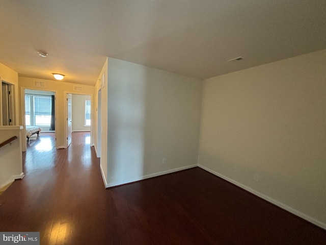 3052 Rittenhouse Cir Unit 52, Fairfax, VA 22031 - unfurnished room with dark wood-style floors and baseboards
