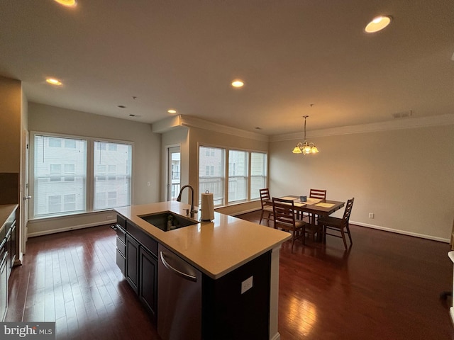 3052 Rittenhouse Cir Unit 52, Fairfax, VA 22031 - kitchen featuring dishwasher, light countertops, dark wood-type flooring, pendant lighting, and ornamental molding