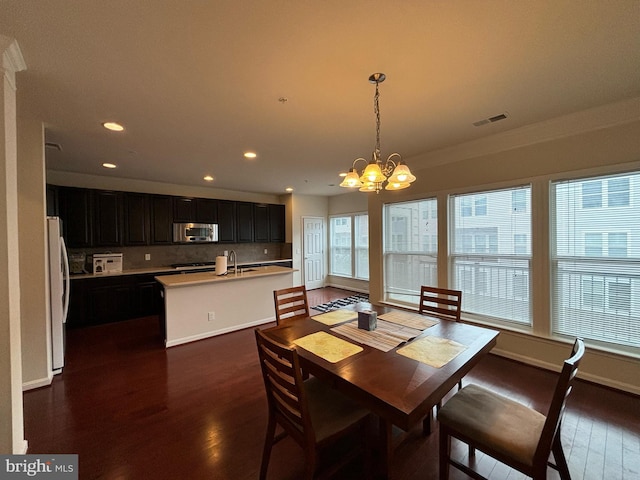 3052 Rittenhouse Cir Unit 52, Fairfax, VA 22031 - dining room featuring dark wood-style floors, a chandelier, recessed lighting, and ornamental molding