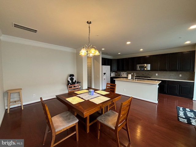 3052 Rittenhouse Cir Unit 52, Fairfax, VA 22031 - dining space featuring ornamental molding, dark wood finished floors, a chandelier, and recessed lighting