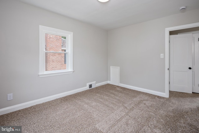 8207 Rockdale Ave, Baltimore, MD 21244 - carpeted spare room with a smoke detector and baseboards